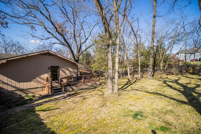 view of yard featuring a wooden deck