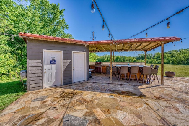 view of patio featuring a bar