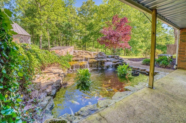 view of yard with a garden pond