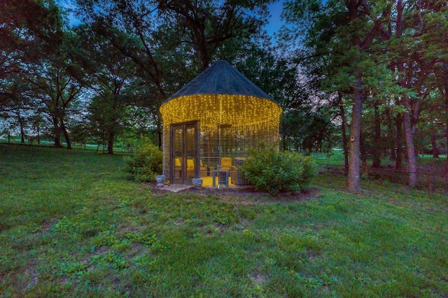 view of outbuilding with a yard