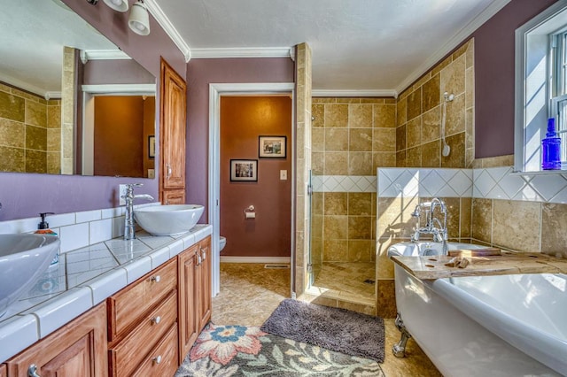 full bathroom with toilet, vanity, independent shower and bath, and ornamental molding