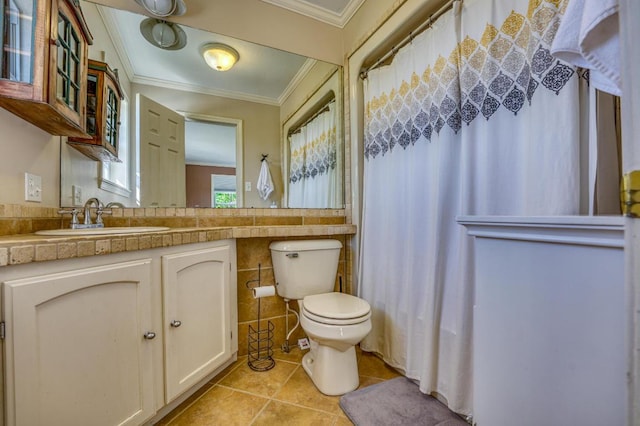 bathroom with tile patterned floors, ornamental molding, vanity, tile walls, and toilet