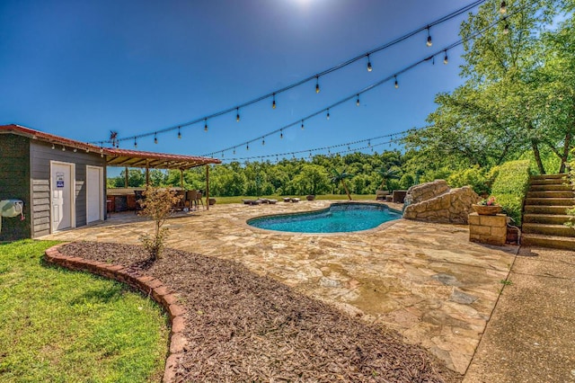 view of pool featuring an outdoor bar and a patio