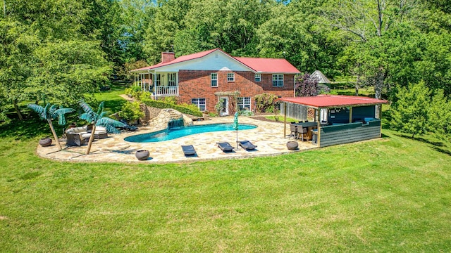 3128 Silver Valley Rd, Harrison, AR 72601 - outdoor pool featuring a patio, a lawn, and a wooded view