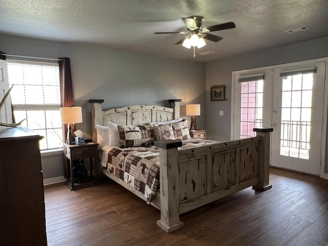 bedroom with dark hardwood / wood-style floors and ceiling fan