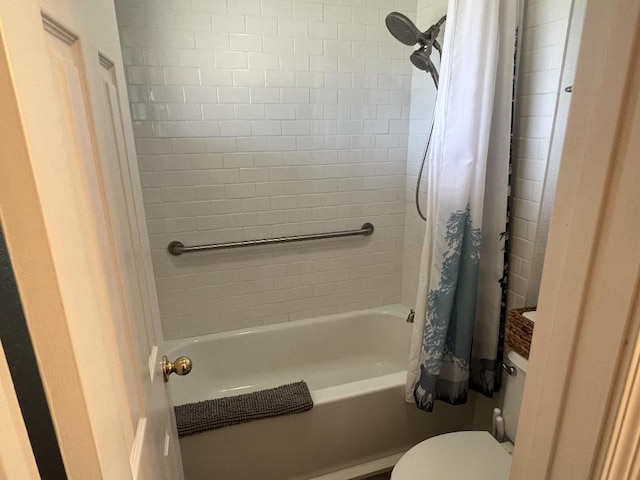 bathroom with shower / tub combo with curtain and toilet