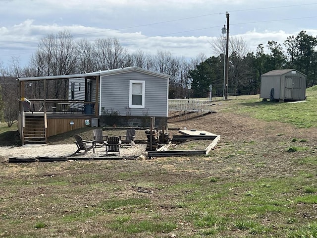 view of yard with a storage shed and a wooden deck