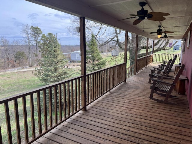 wooden deck featuring ceiling fan