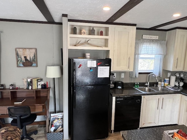 kitchen featuring a textured ceiling, light hardwood / wood-style floors, sink, and black appliances