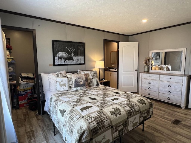 bedroom featuring ornamental molding and dark wood-type flooring