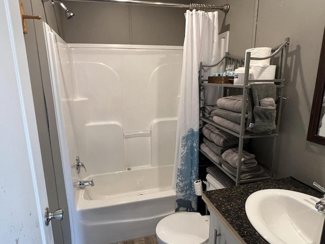 full bathroom with shower / bathtub combination with curtain, toilet, and vanity