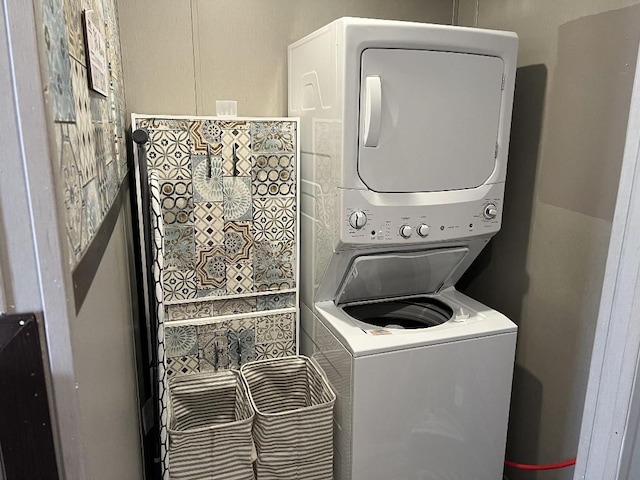 laundry room with stacked washer and clothes dryer