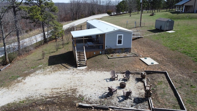 rear view of house featuring a deck