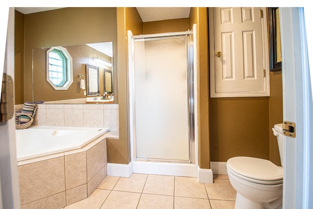 bathroom featuring toilet, plus walk in shower, and tile patterned floors