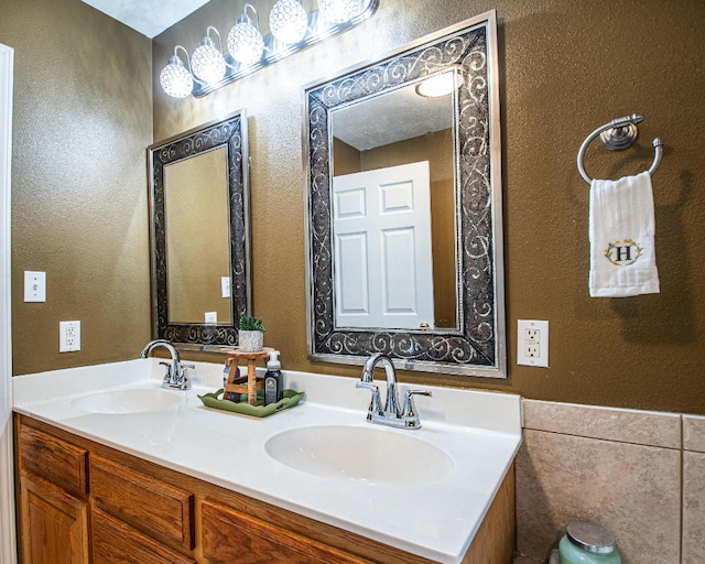 bathroom featuring tile walls and vanity