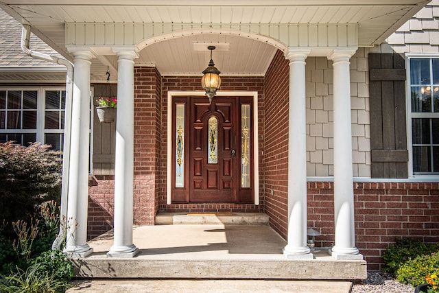 doorway to property featuring covered porch