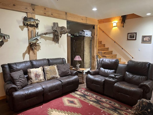 living room featuring beamed ceiling