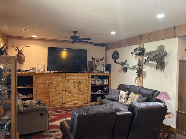 living room featuring ceiling fan and hardwood / wood-style floors