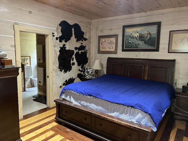 bedroom with light hardwood / wood-style floors and wooden ceiling