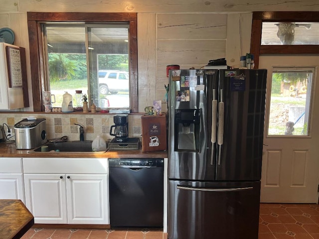 kitchen with white cabinets, black dishwasher, wood counters, stainless steel fridge with ice dispenser, and sink