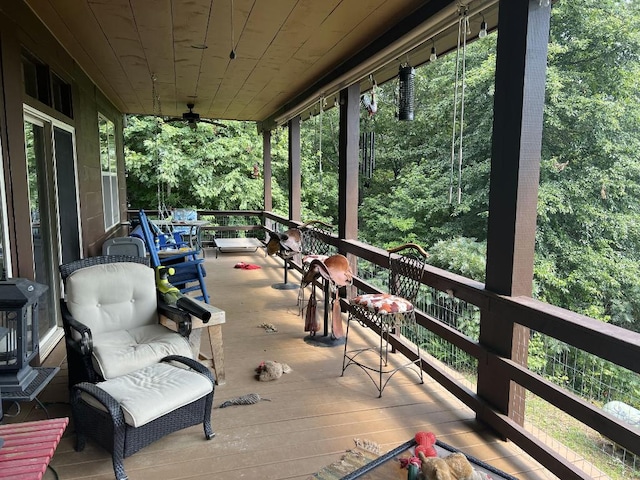 exterior space featuring ceiling fan