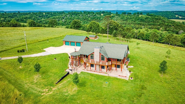 birds eye view of property with a rural view and a forest view