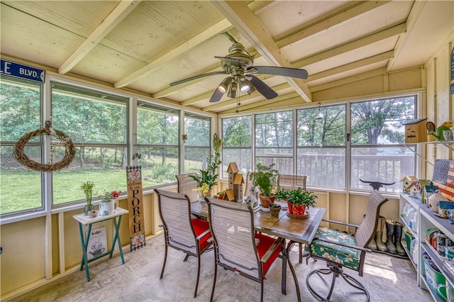 sunroom featuring vaulted ceiling, ceiling fan, and plenty of natural light