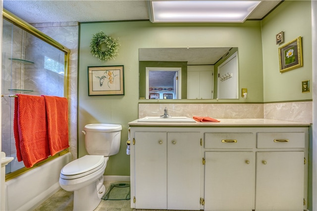 full bathroom with tile patterned flooring, a textured ceiling, shower / bath combination with glass door, vanity, and toilet