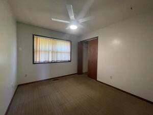 unfurnished bedroom featuring a closet and ceiling fan