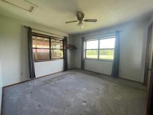 unfurnished room featuring ceiling fan