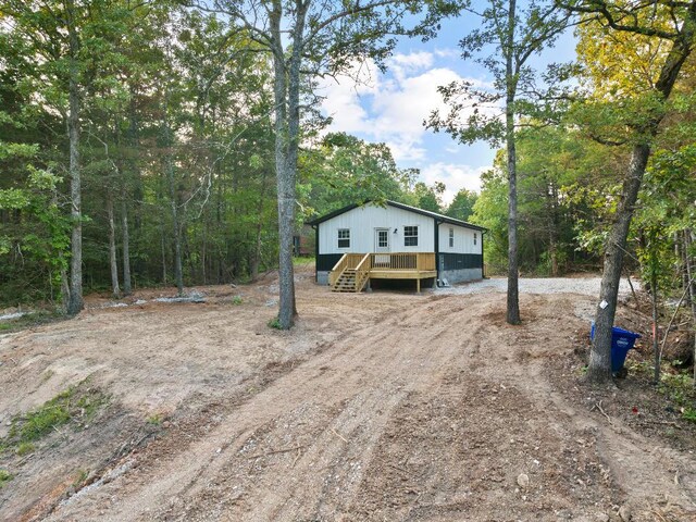 view of front of house with a wooden deck