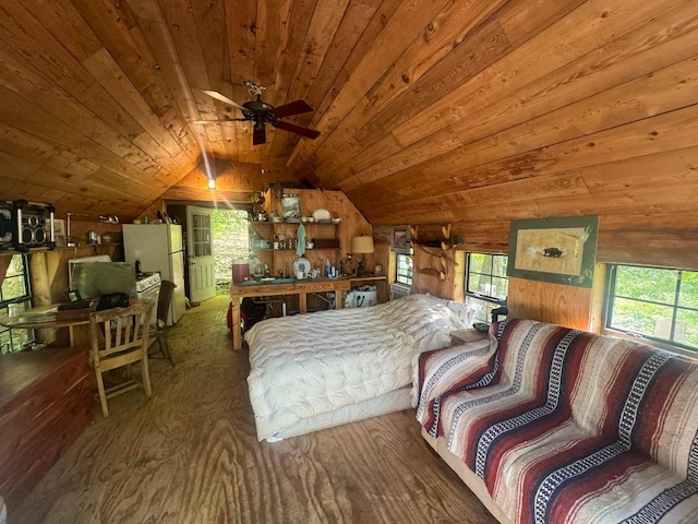 bedroom featuring wooden ceiling, vaulted ceiling, and white refrigerator