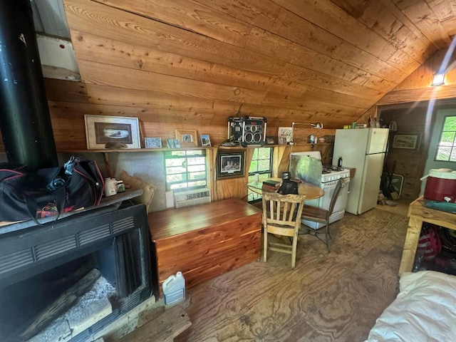 kitchen with a wealth of natural light, lofted ceiling, wooden ceiling, and white refrigerator