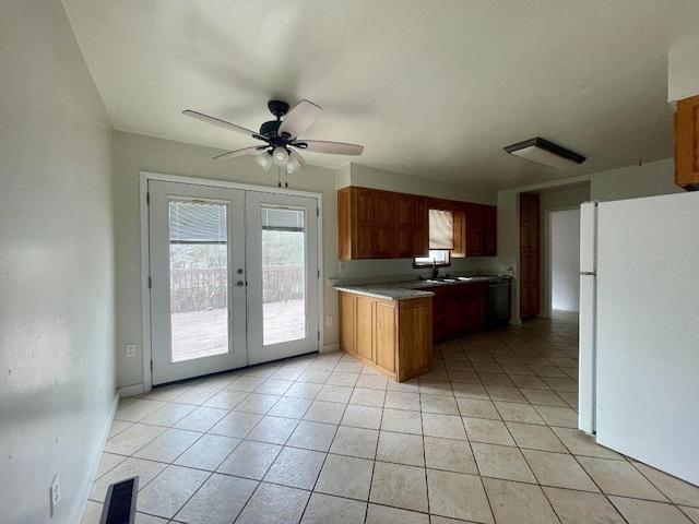 kitchen featuring ceiling fan, dishwashing machine, light tile patterned floors, french doors, and white refrigerator