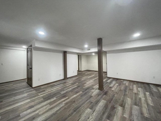 basement featuring dark hardwood / wood-style floors