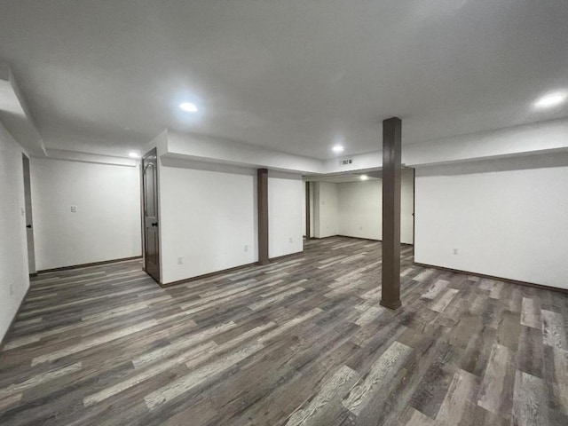 basement featuring dark wood-type flooring