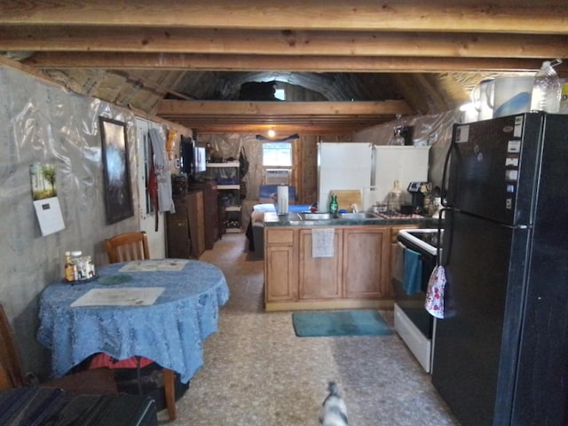 kitchen with white range with electric stovetop, sink, and black fridge