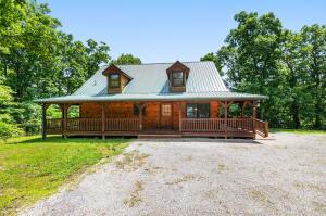 rustic home featuring a porch