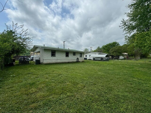 view of yard with central AC