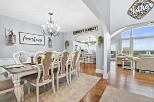 dining area featuring a chandelier and wood-type flooring