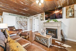 living room featuring ceiling fan and hardwood / wood-style floors