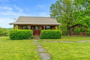 bungalow featuring a gazebo and a front yard