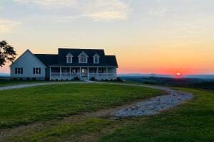 new england style home featuring a yard