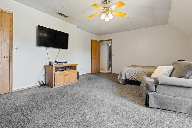 carpeted bedroom featuring ceiling fan and vaulted ceiling