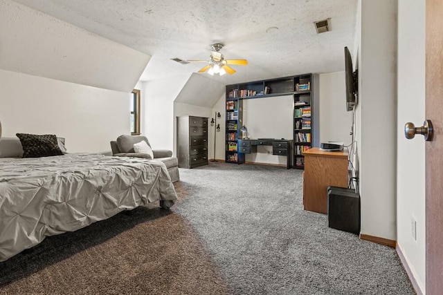 carpeted bedroom with ceiling fan, vaulted ceiling, and a textured ceiling