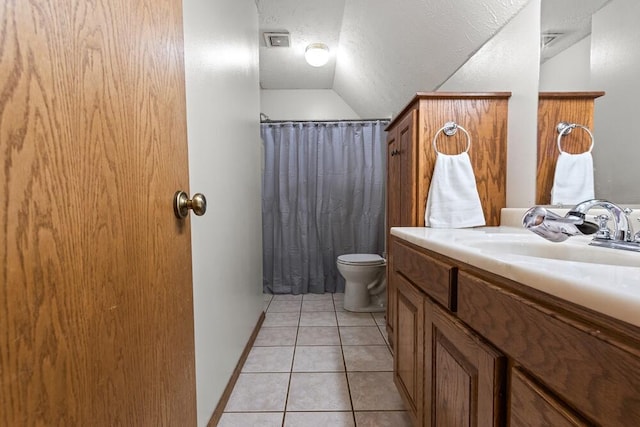 bathroom with toilet, vanity, tile patterned floors, vaulted ceiling, and walk in shower