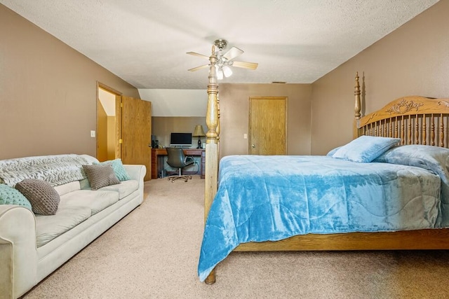 bedroom with a textured ceiling, carpet floors, and ceiling fan