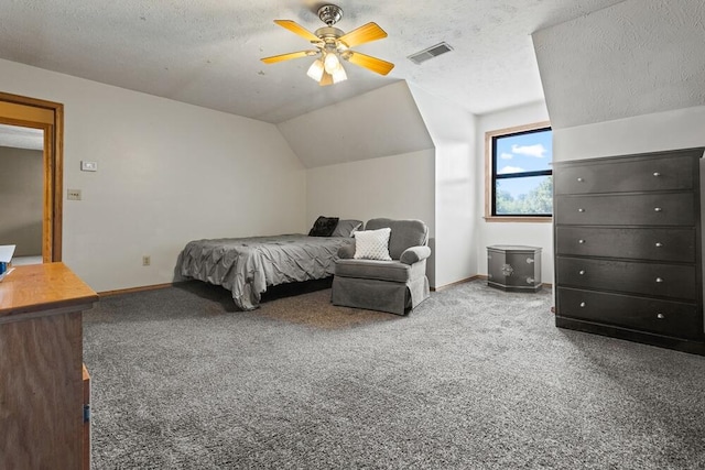 bedroom with a textured ceiling, ceiling fan, lofted ceiling, and carpet flooring