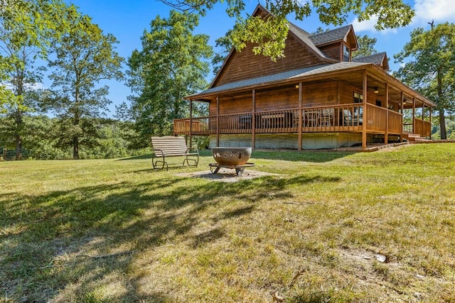 exterior space with a deck and a lawn