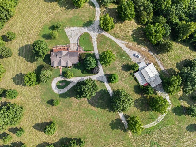 birds eye view of property with a rural view